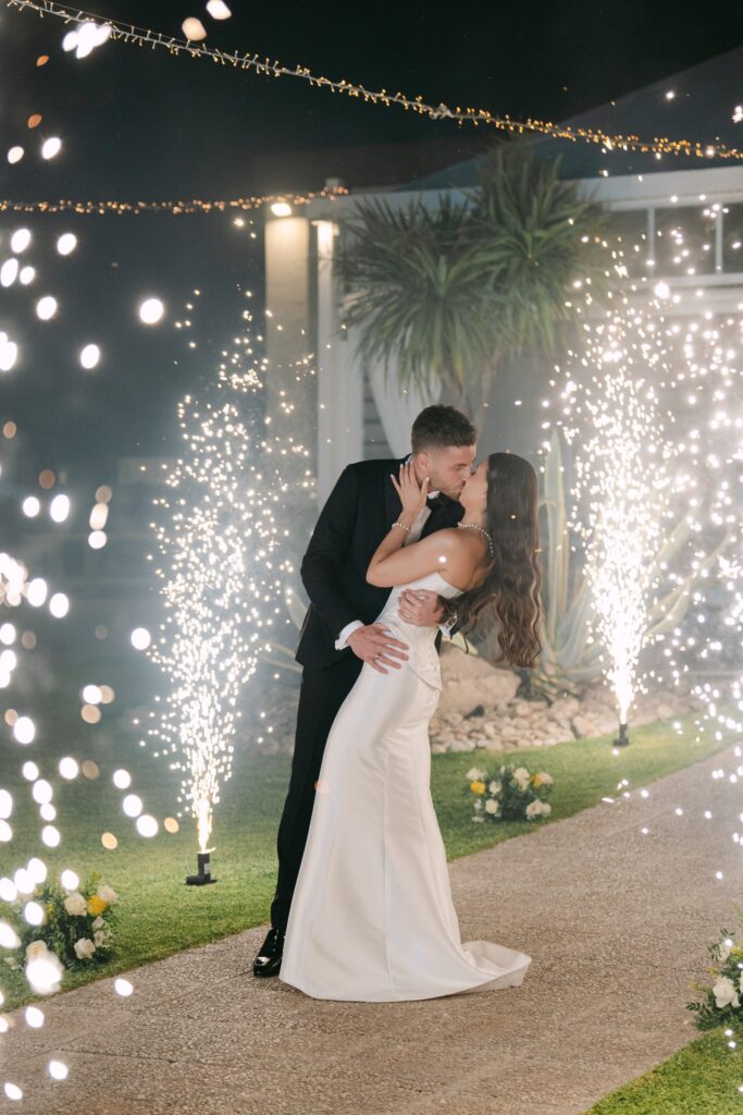 Andreas & Dimitra, wedding in Patras: a kiss between sparklers