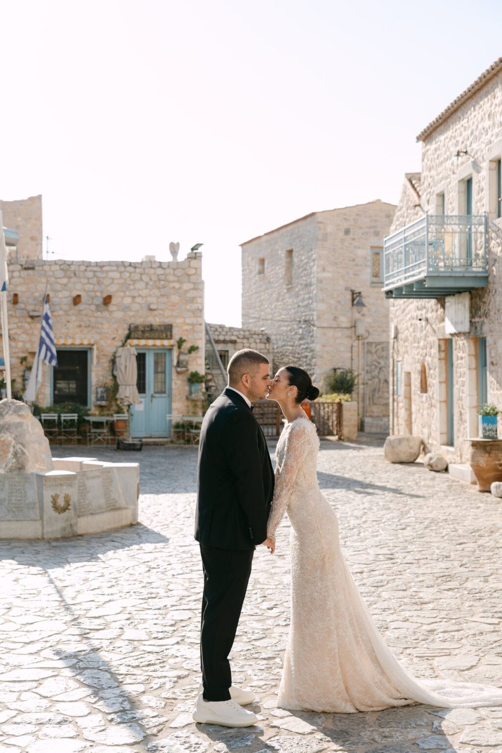 A kiss among the stone houses of Mani
